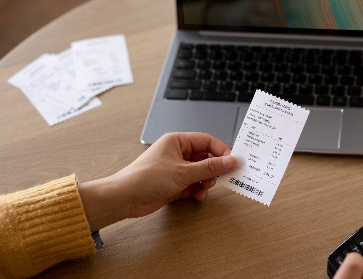 close-up-hand-holding-receipt_edited.jpg