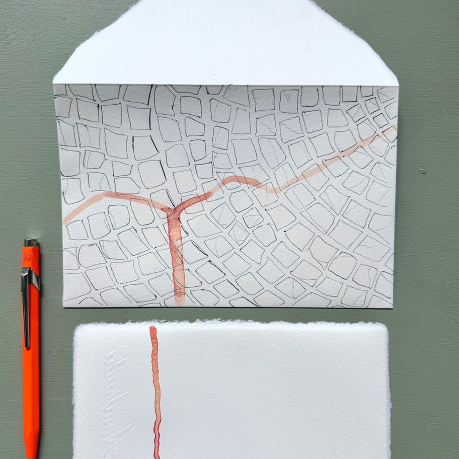 Original drawings and watercolor traces transform each envelope into a unique object.