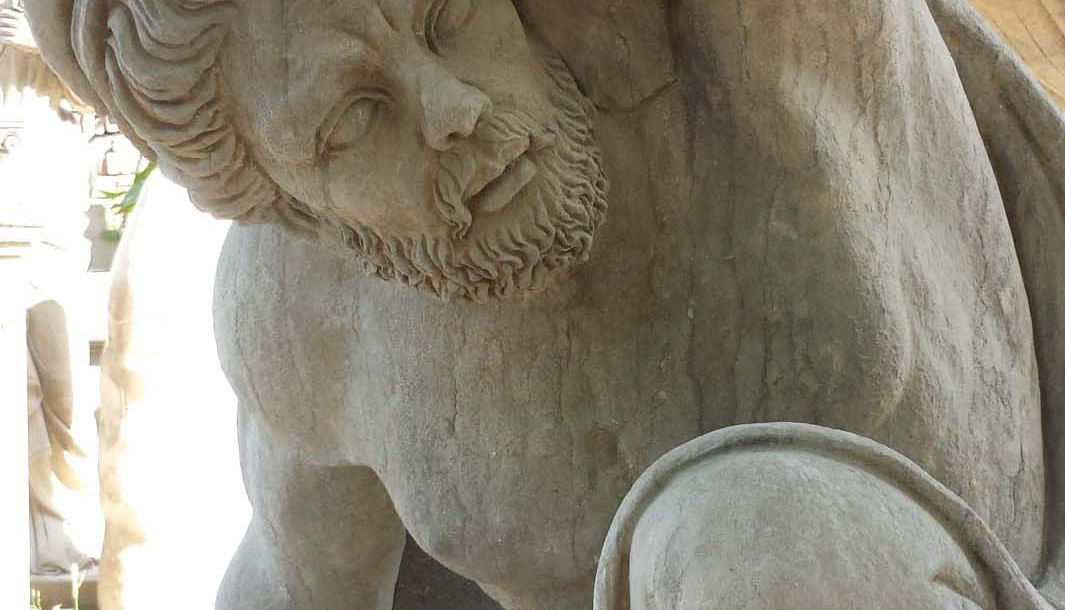 man statue carrying a bowl, handmade by natural stone