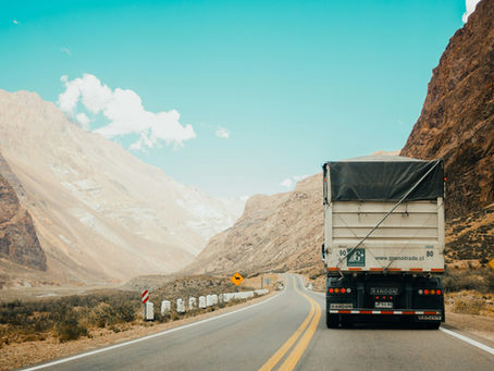 White delivery van on a UK road — OBD GPS tracker guide by Tracking Hardware UK