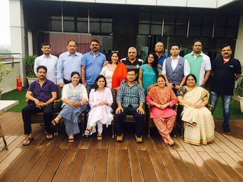 Portrait of a Pranavam Wellness staff member in a professional setting.