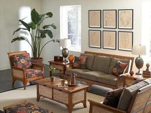 A richly detailed traditional Indian living room with carved wooden furniture, brass lamps, patterned rugs, and heritage wall art, showcasing timeless interior design elements.