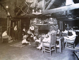 Historic photo of guests in OTO lodge's main room.