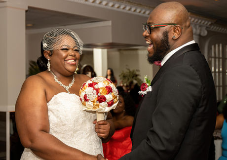 Happy couple exchanging vows at their wedding ceremony