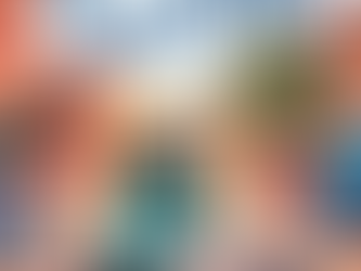 A girl with dark hair runs through a city street holding paper. Background shows red buildings. Text: When You Reach Me, Rebecca Stead.