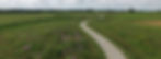 An aerial view of Hadley Valley and the trail running through the prairie.