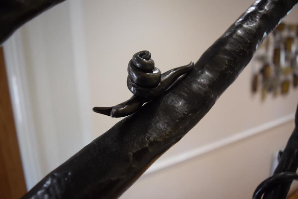 Snail on Tree Stair Rail
