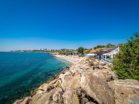 A rocky coastline with a restaurant overlooking the Black Sea