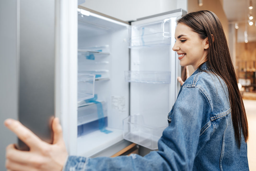 young-attractive-woman-choosing-refrigerator-hypermarket.jpg