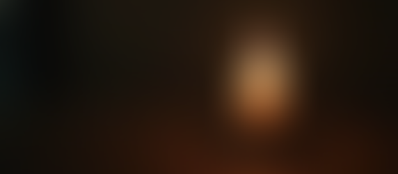 High angle view of a burning candle at SCG Witchery in a dark room