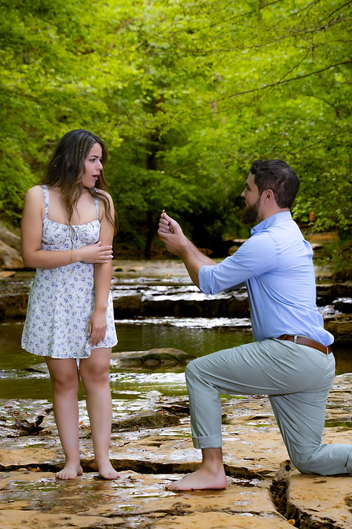 Surprise engagement shoot. Male suprises his fiance with engagment ring and pops the question. No moment missed by photographer.