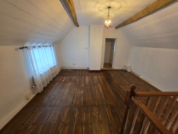 Upstairs room empty after full house clearance in Houghton on the Hill.