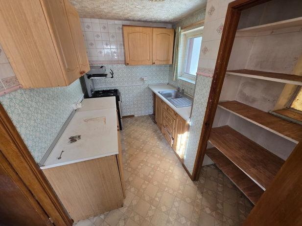 Kitchen cleared and empty after bereavement house clearance in Glen Parva.