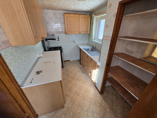 Kitchen cleared and empty after bereavement house clearance in Glen Parva.