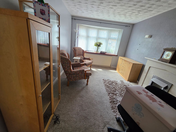 Lounge at new Countesthorpe property after delivery of large items.
