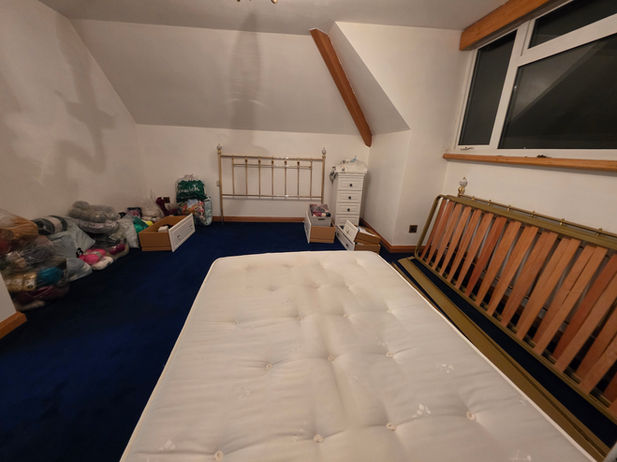 Bedroom at the new Newton Harcourt property after furniture was unloaded and placed.