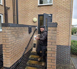 2 Men & Van moving furniture into Luton van in 