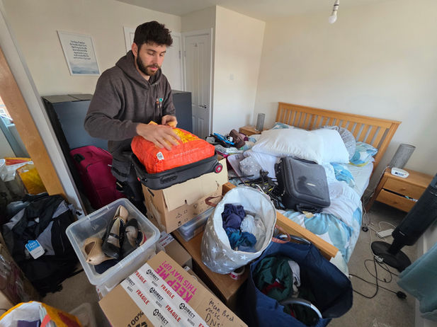 Removal team member packing and labelling boxes during full house packing service in New Lubbesthorpe.