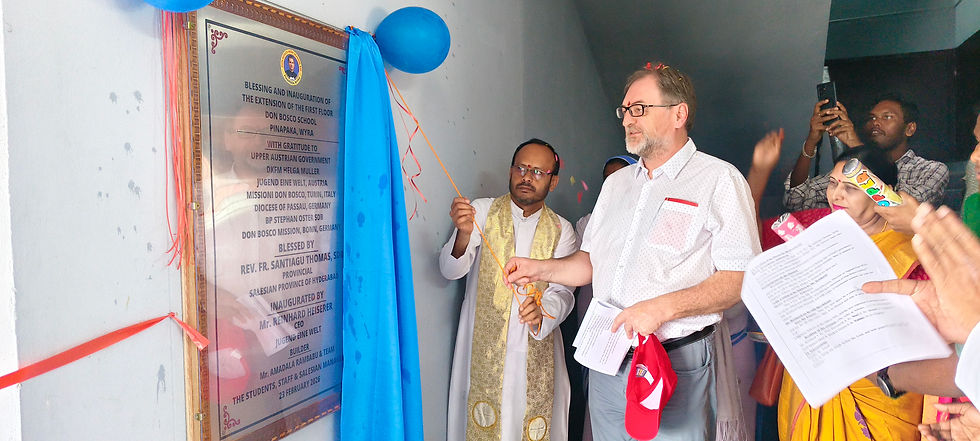 Mr. Reinhard Heiserer and Fr. Santiagu Thomas, SDB, Provincial of the Salesian Province of Hyderabad, unveil the commemorative plaque marking the inauguration of the first-floor extension at Don Bosco School, Pinapaka.