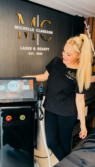 Michelle Clarkson, laser specialist at MC Laser & Beauty, beside medical-grade laser equipment.