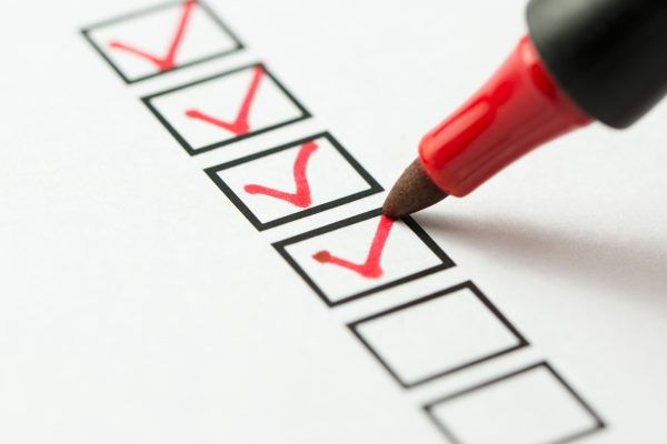 red marker checking boxes