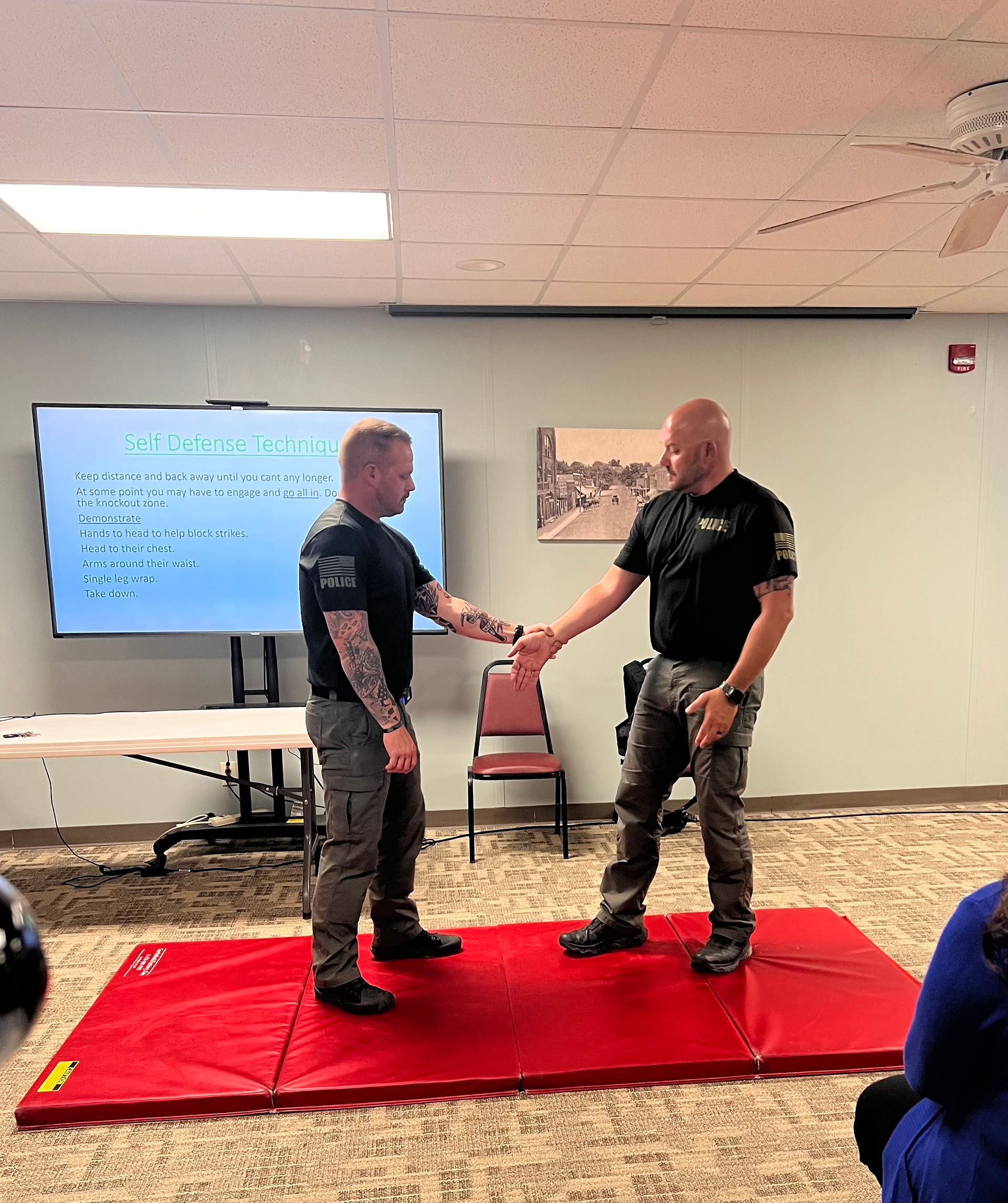 Sergeant Joe Jany and Officer Steve Laramore demonstrate techniques.