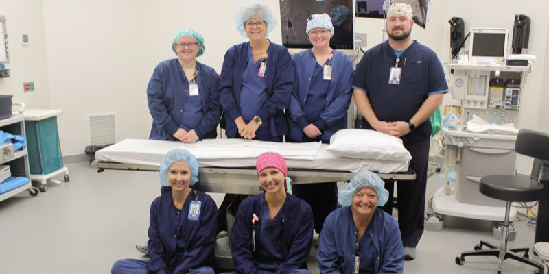 OR staff gather on the new surgical suite flooring following a successful upgrade.