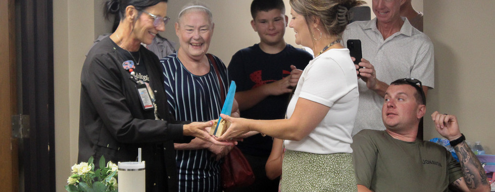 Rhonda receiving her award.