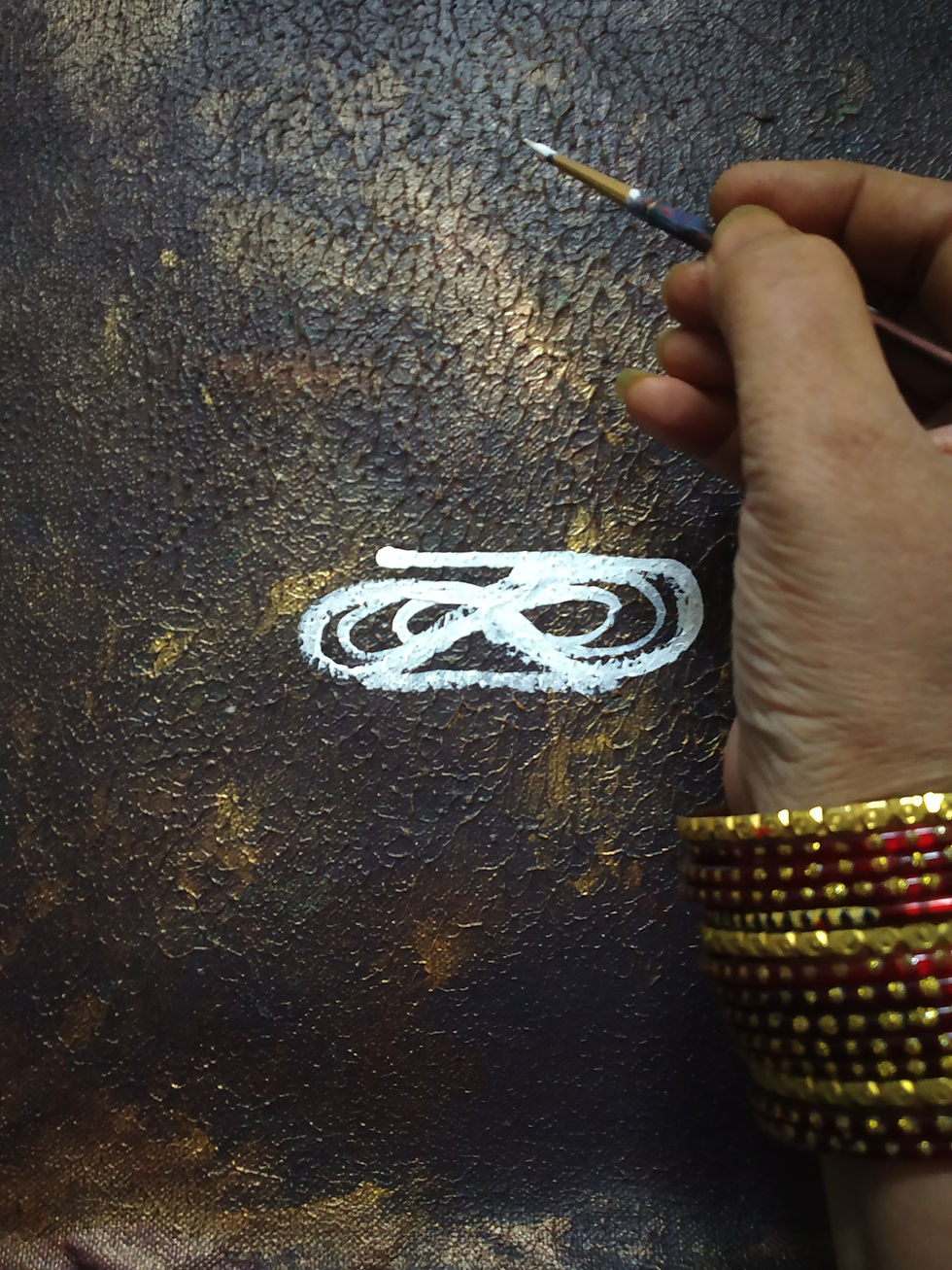 Thumbnail: Hand painting white symbol on dark background