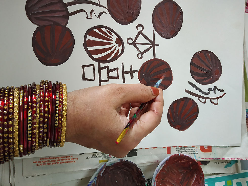 Thumbnail: Hand with bangles painting brown abstract patterns