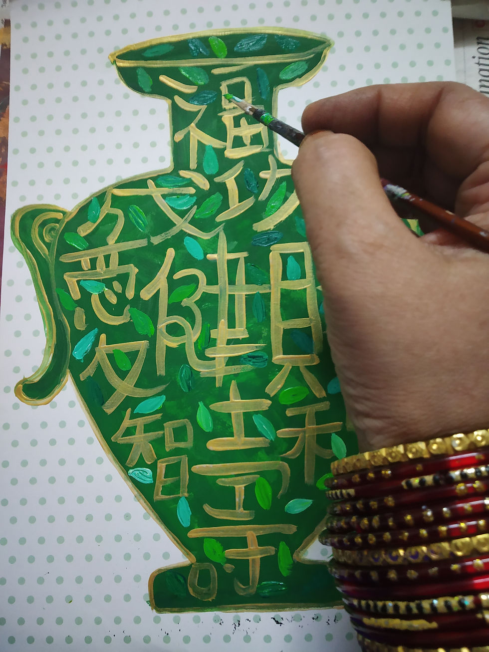 Thumbnail: Hand painting a green vase with gold Chinese characters
