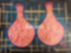 Two decorative pink bottles with gold patterns, Razarts