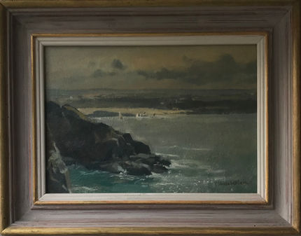 A subtle coastal view of a rocky shore at high tide.