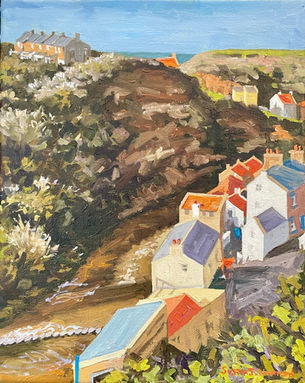 A view of Staithes Beck and cottages looking down into the gorge and stepping stones.