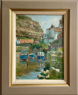 A vibrant, intimate view of Staithes Beck at High Tide with boats floating on the water and Cowbar Nab and cottages reflected in the water.