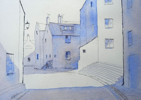 Bright light and blue shadows fall on the High Street towards the Cod and Lobster pub.