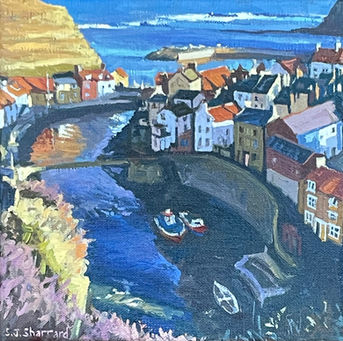 Afternoon light illuminates the left hand side of Staithes Beck in contrast to the shadows of the Beckside cottages and riverbed.