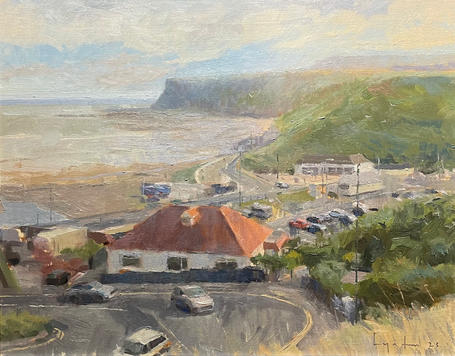 A sweeping view looking down over the winding road of Saltburn Bank, the beach and sea front.