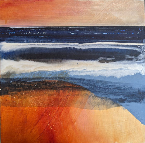 A striking view of sand, sea and sky dominated by the red glow of the sky reflected in the wet sand and contrasting with the blue and White Sea.