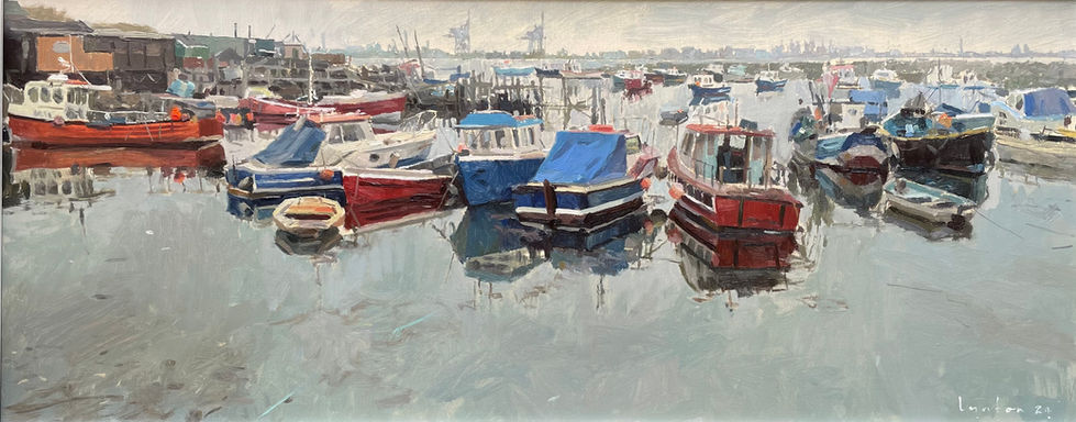 A panoramic view of a variety of boats moored at the popular settlement on the mouth of the Tees looking towards the industrial sites on the North side in the distance.