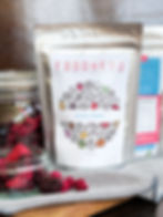 Freeze-dried mixed berries displayed in a clear glass jar showing vibrant colours and texture