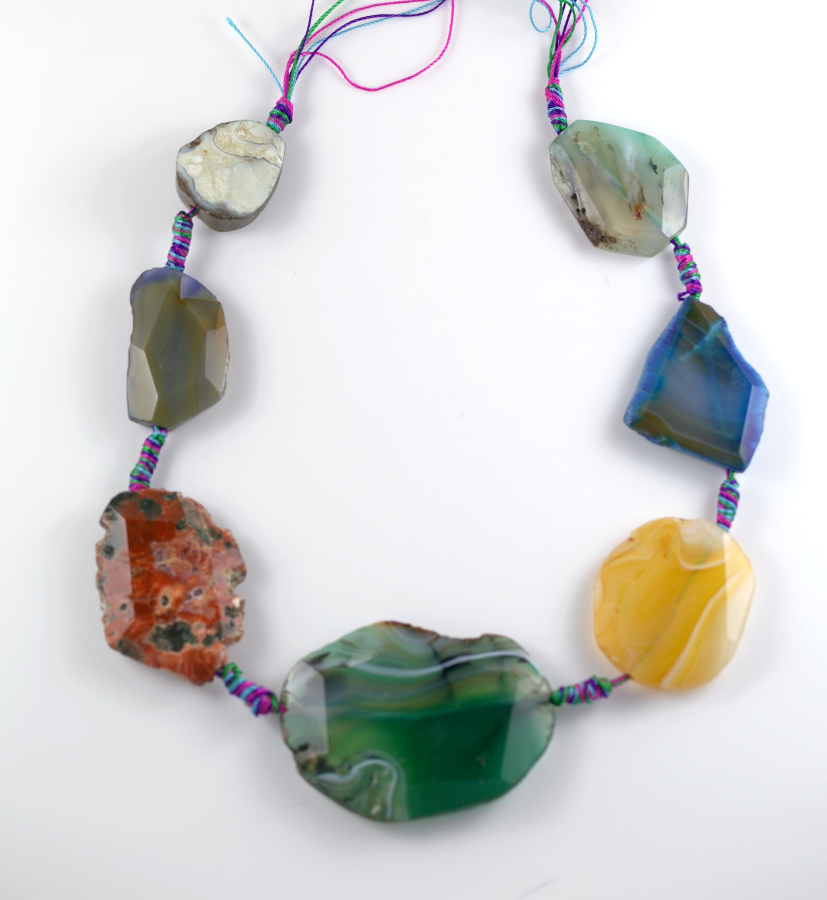 Thumbnail: Mixed Agate Slab Strands Largest Bead 56.5mm Hole to Hole