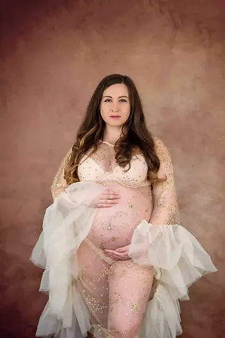 Professionelle Fotografin bei einem Babybauch Shooting in Heiden.