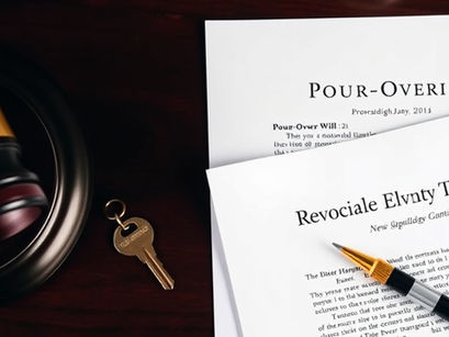 Pour-over will and revocable living trust documents with estate planning assets