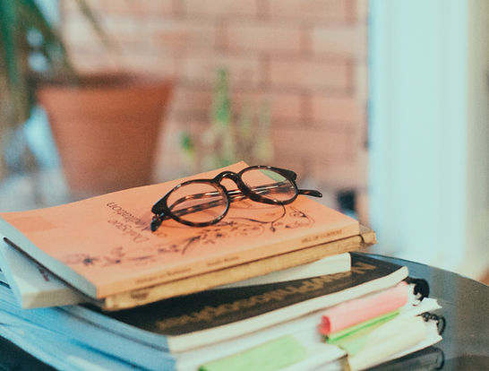 glass on top of notebooks