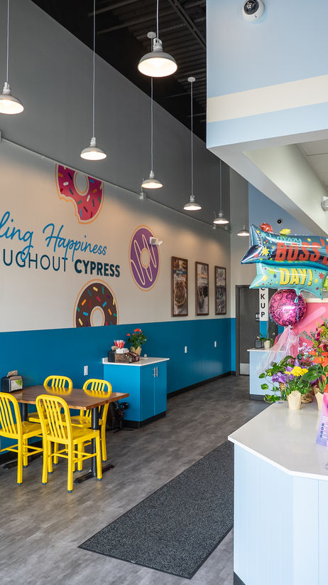 Completed Duck Donuts commercial space with branded finishes.
