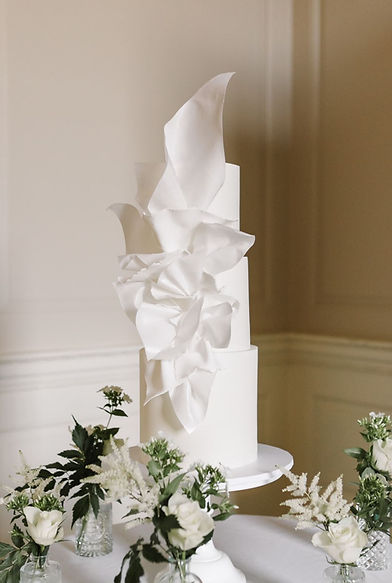 Three tier modern white wedding cake.jpg
