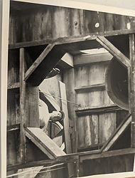 Rev Dr Dale Meyer looking through the hole for the new bell at St Salvator Lutheran Church