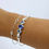Thumbnail: Blue Topaz, Blue Quartz, and Freshwater Pearl Latching Cuff- on model