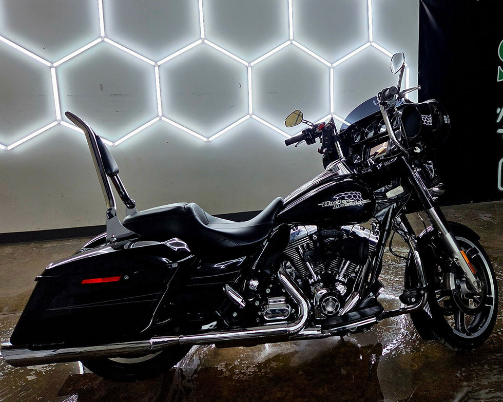 Polished black motorcycle, auto detailing